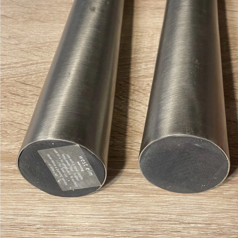Elegant pewter taper candle holders by West Elm .